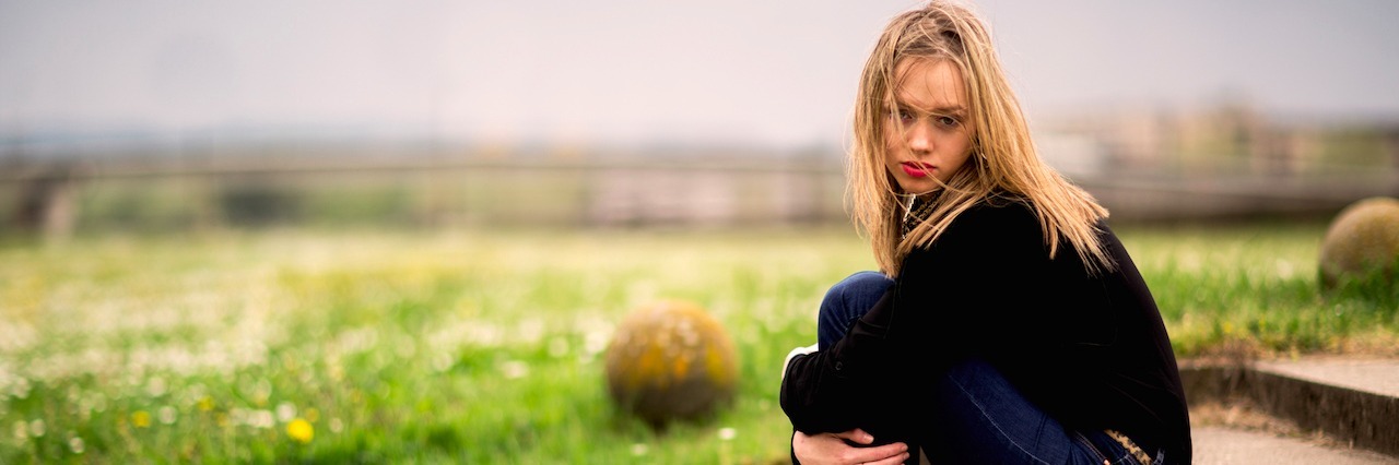Stigmas About Anxiety and Depression woman sitting on the steps outside