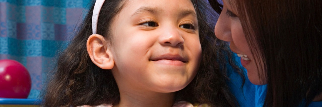 How to Help Your Child Cope With a Medical Emergency Mom holding daughter in hospital, smiling