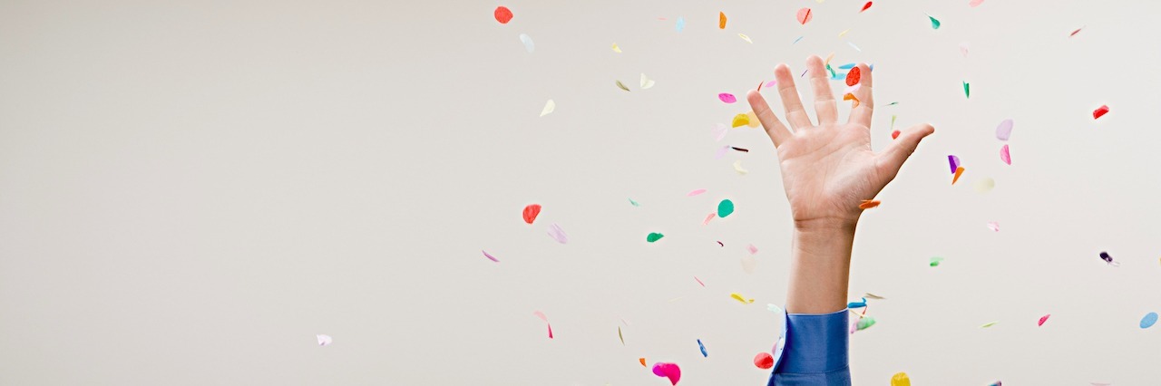 What Happens After Social Events When You Live With Mental Illness hand throwing up confetti