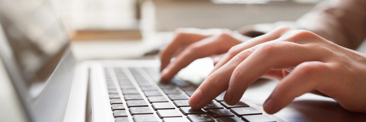 How to Support Someone With Borderline Personality Disorder Typing on laptop closeup, chatting in Facebook, meeting website. Blogger, journalist writing new article.