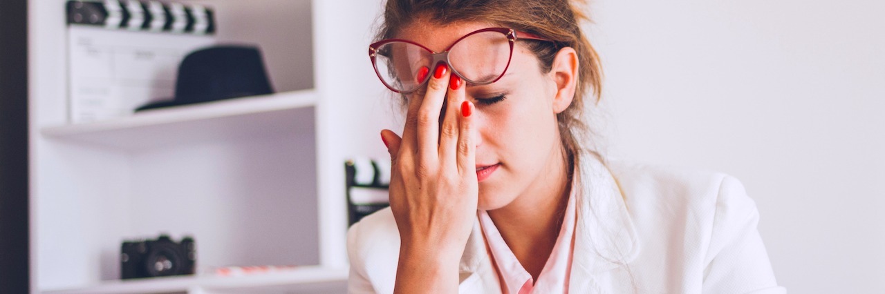 How Anxiety Can Ruin Your Day A stressed out woman sitting at a desk in her home
