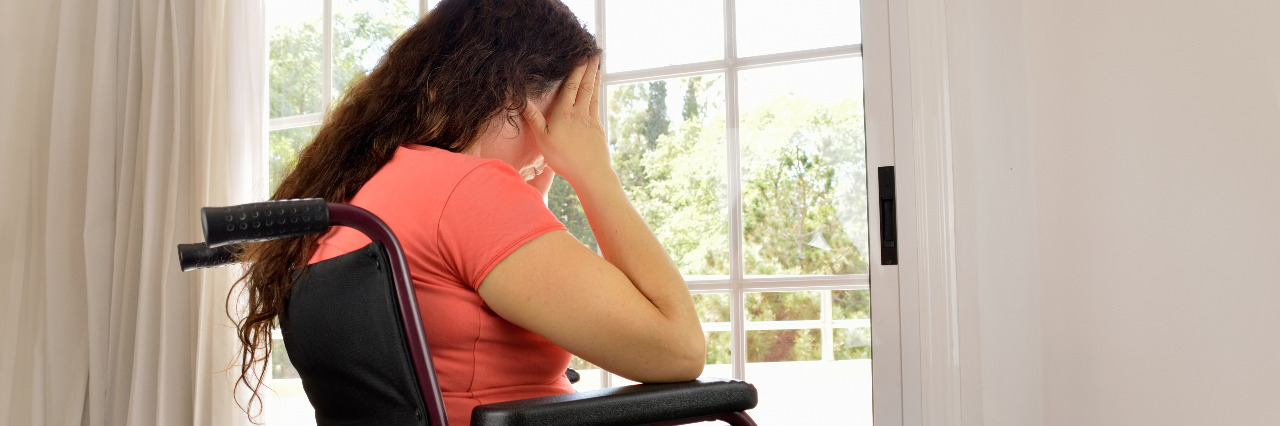 Worried woman in a wheelchair.