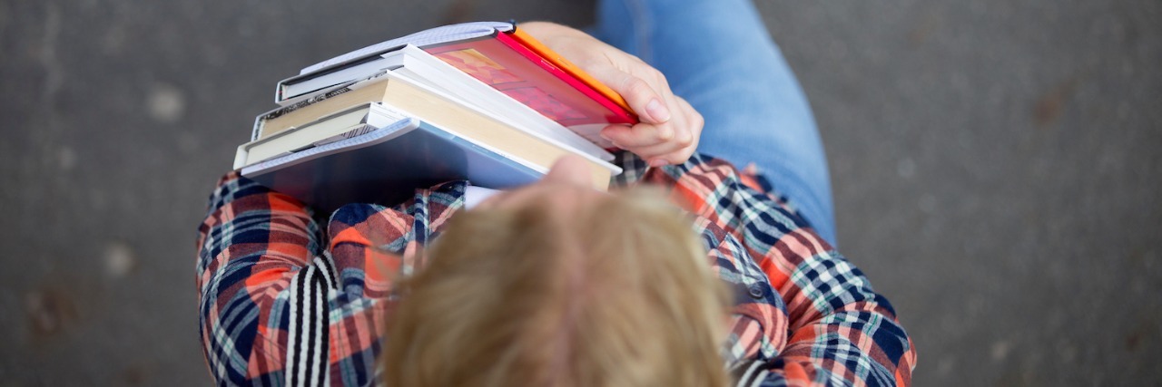 A Letter to My Teacher About My Struggles Student holding textbooks