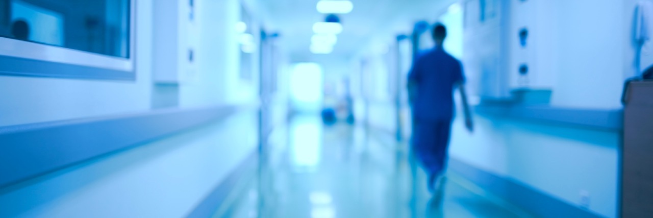 How Becoming Chronically Ill has Affected My Journey as a Nurse Hospital corridor and doctor as a blurred defocused background