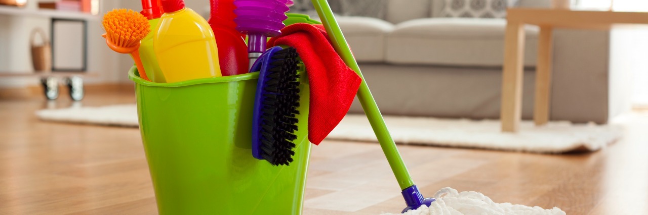 When You Can't Clean Your House Anymore Due to Illness Plastic bucket with cleaning supplies in home