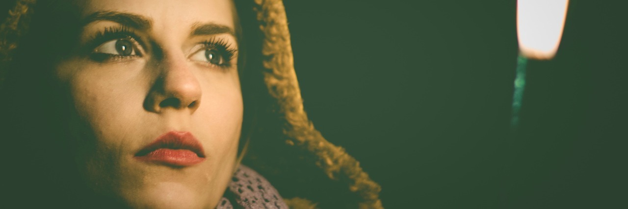 An Apology to Myself in Recovery From Anorexia woman in the dark looking at fire