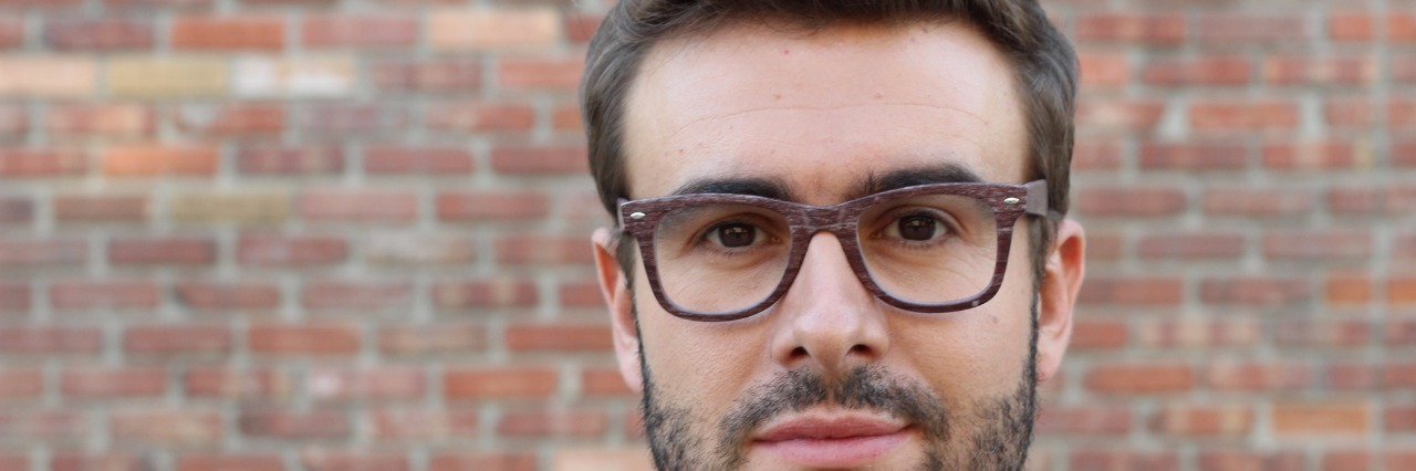 Loving Someone Who Has Depression and Anxiety Young attractive man looking at the camera with copy space.