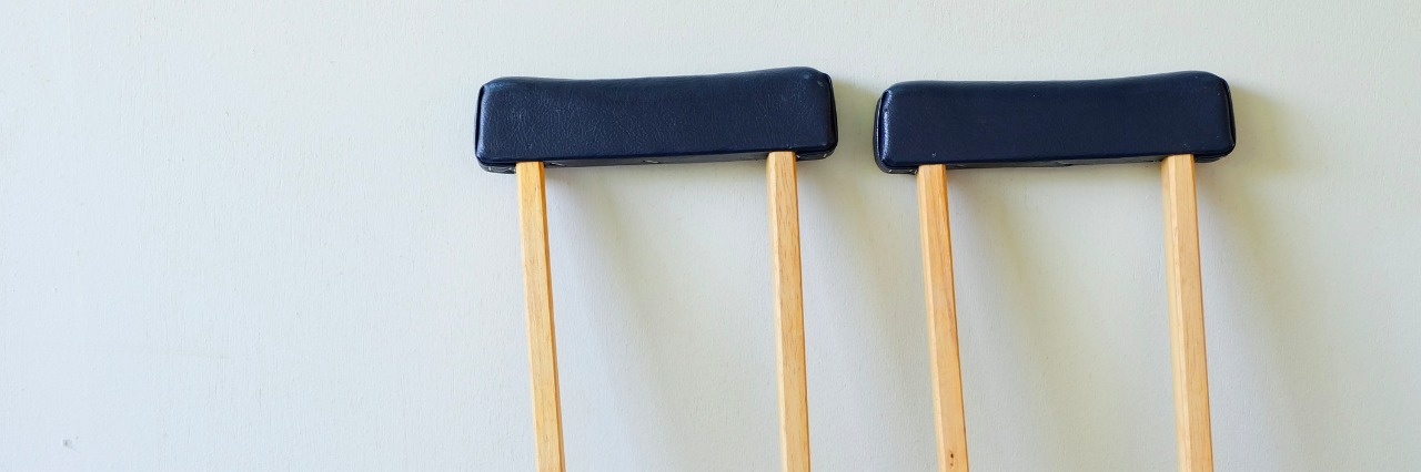 To the Girls Who Questioned Why I Only Occasionally Used Crutches crutches leaning against wall