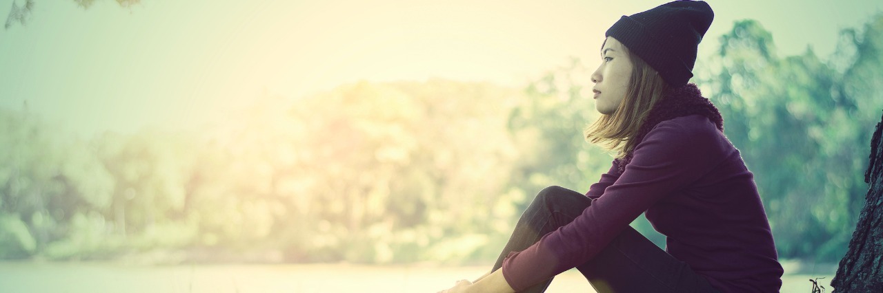 Toni Bernhard's 6 Common Misconceptions about the Chronically Ill Portrait of lonely young woman sitting looking something lonely ,soft focus