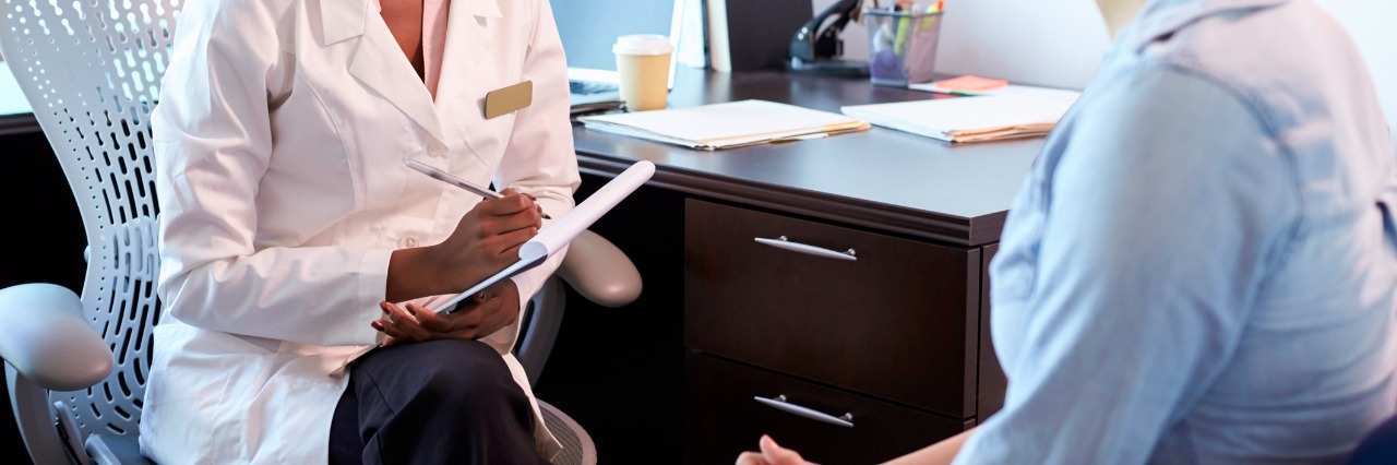 The Time My Doctor Swore During an Appointment Doctor In Consultation With Female Patient In Office
