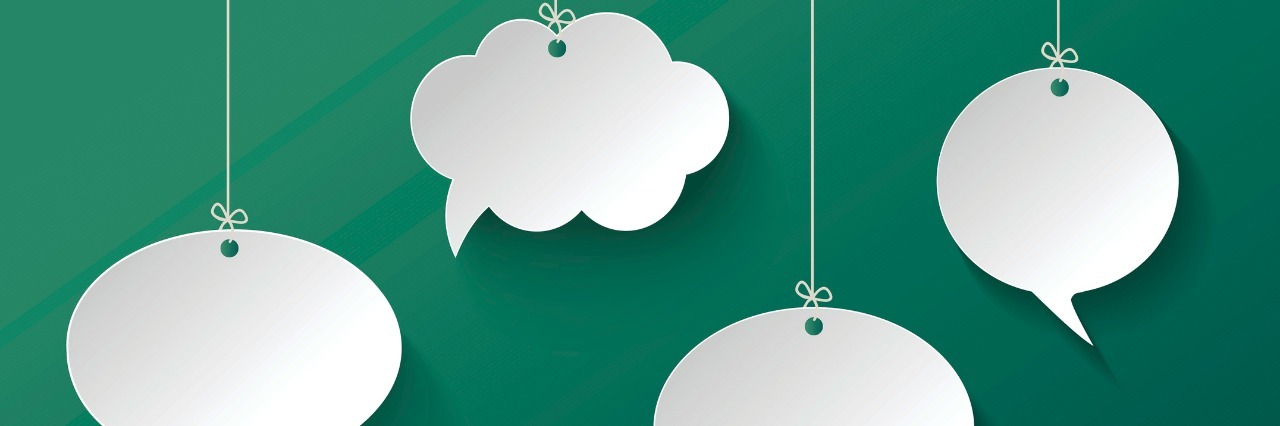 White Speech Bubble Hanging on the Green Background