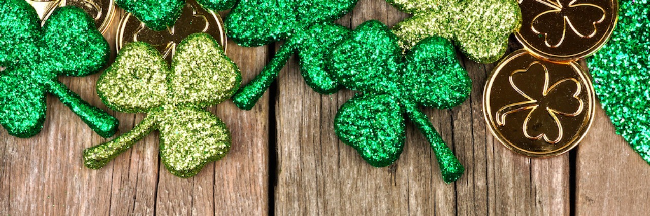 12 Things Not to Say to Your Friend Who Isn't Drinking This St. Patrick's Day double border of shamrocks. Text reads: 12 things not to say to your friend who isn't drinking this St. Patrick's Day