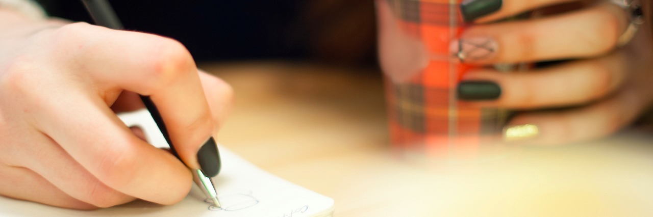 A Thank You to The People Who Helped Me After My Suicide Attempt woman writing in her journal