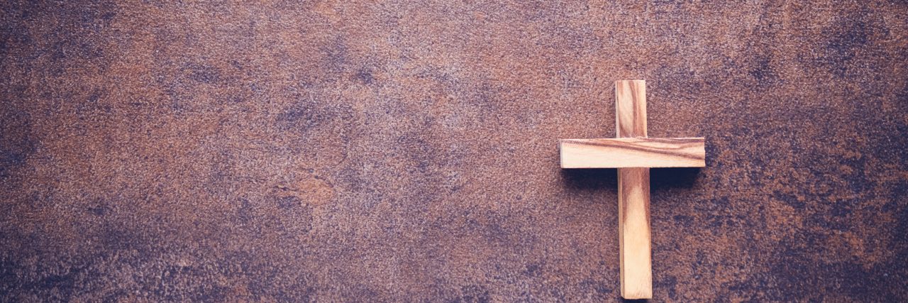 Choosing to Eat Meat During Lent Because of My Eating Disorder He is risen word and wooden cross on dark background