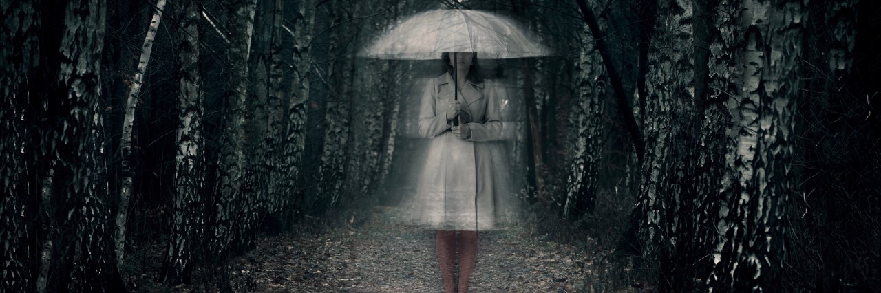 Why I Struggle When People Tell Me, 'I Hope You are Feeling Better' woman standing in woods holding umbrella