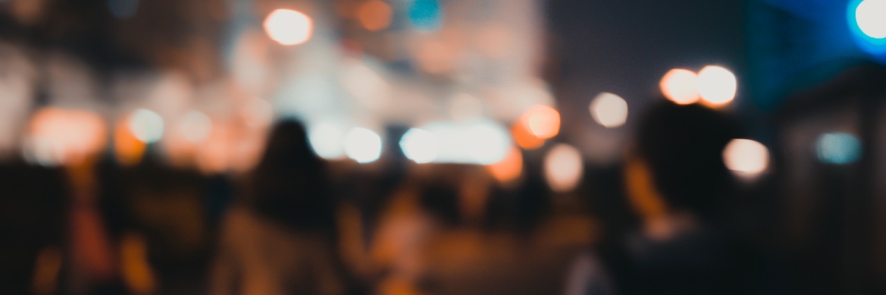 22 Things People Don't Realize You're Doing Because of Dysautonomia Abstract bokeh background of people walk at the park on night