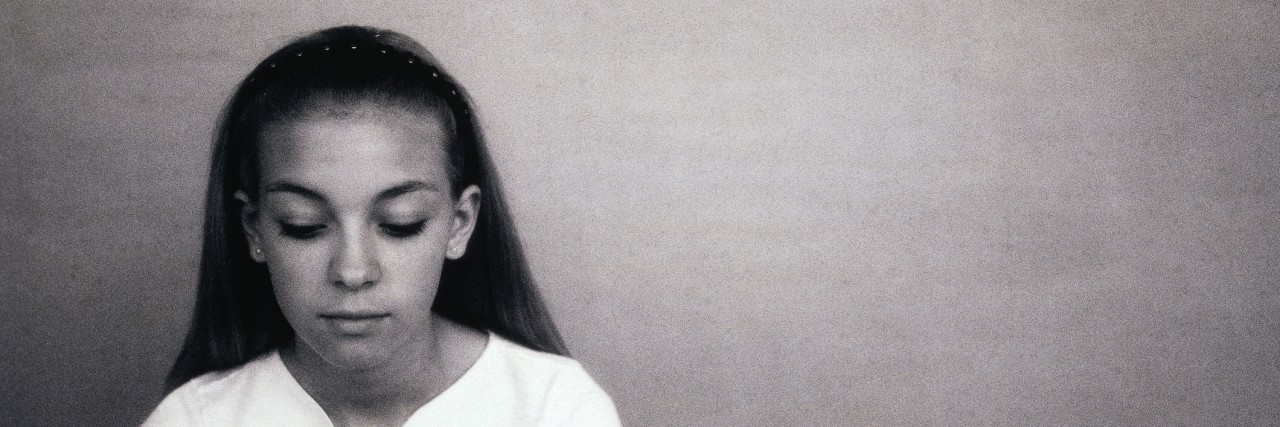 When I'm in the Darkest Moments of My Eating Disorder Recovery Teenage girl looking down