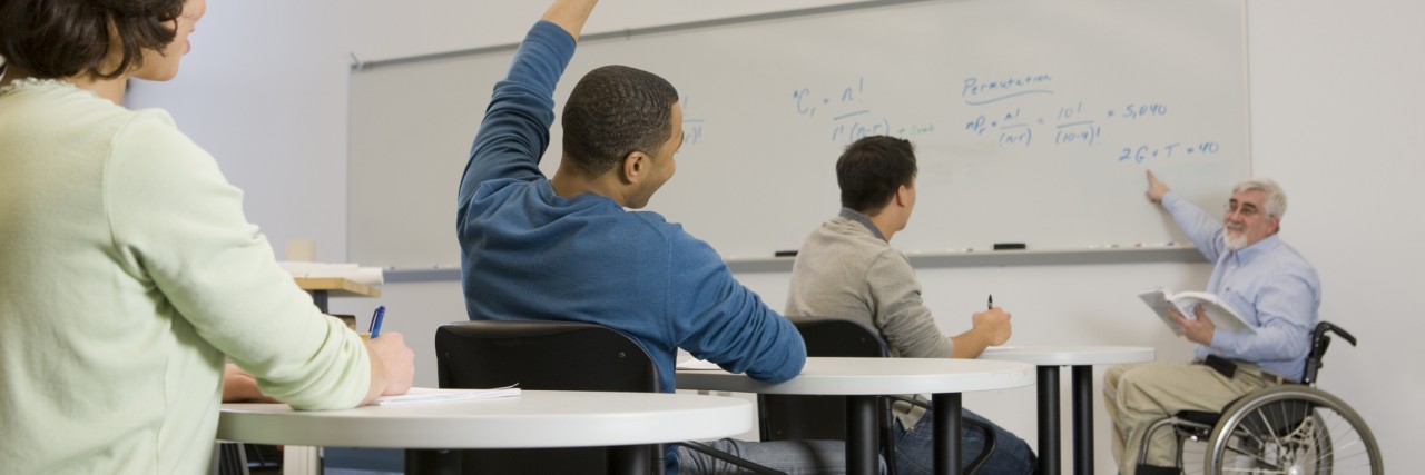 Respected as a Professional but Not as a Patient With a Disability University professor teaching his students in a classroom.