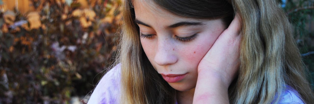 How I'm Learning to Embrace My Anxiety and Depression sad looking girl