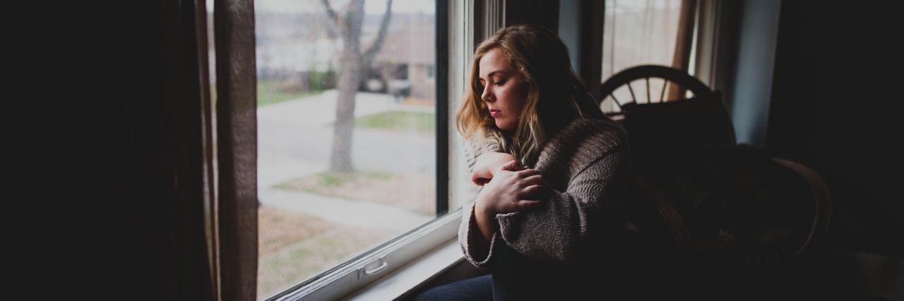 Answering 'What Are You Doing' When Mental Illness Keeps You From Work woman at window
