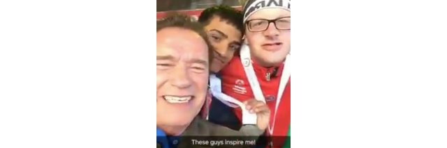 Arnold Schwarzenegger takes a video selfie with Special Olympics athletes.