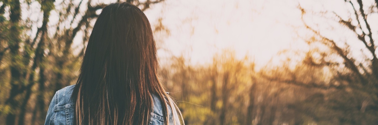 When Your 'Normal' With a Chronic Disease Changes Brunette young woman walking the forest road