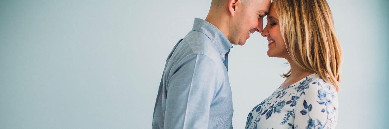 A Letter to My Unborn Son, From Your Mom With Crohn's Disease pregnant woman and man facing each other touching foreheads