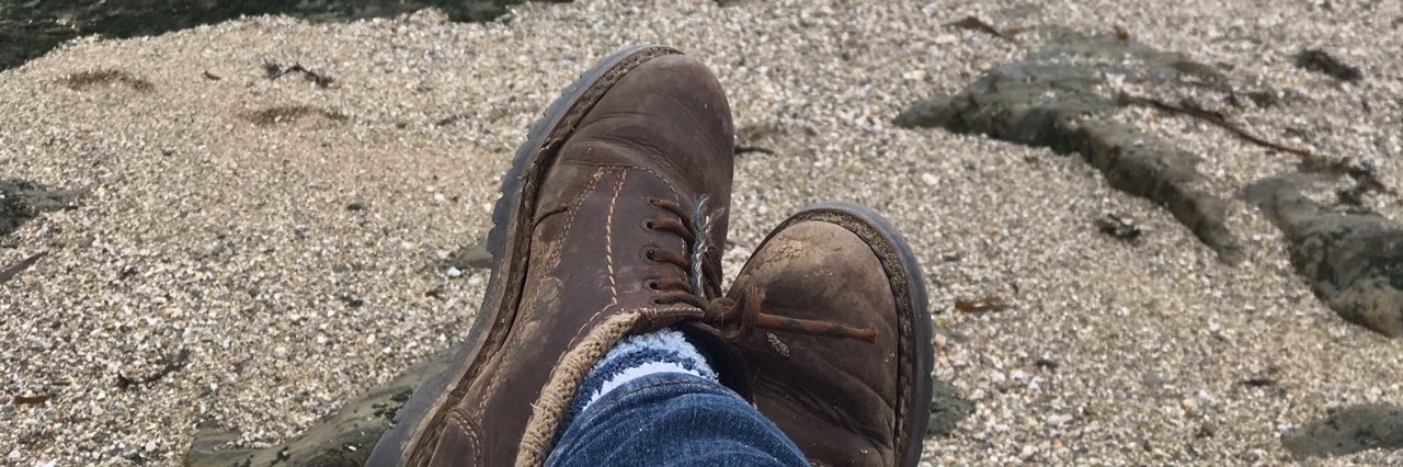 You Don't Have to be 'Old' to Have Arthritis boots on sand overlooking ocean