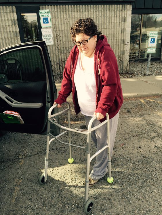 A former ballerina, older, using a walker.