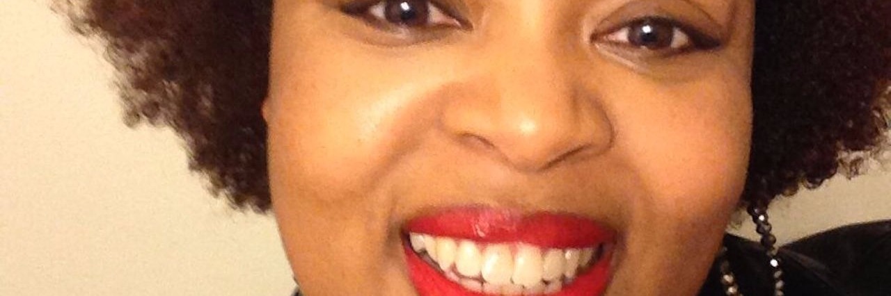 Being Diagnosed With Fibromyalgia, Rheumatoid Arthritis in Your 20s woman wearing red lipstick and smiling