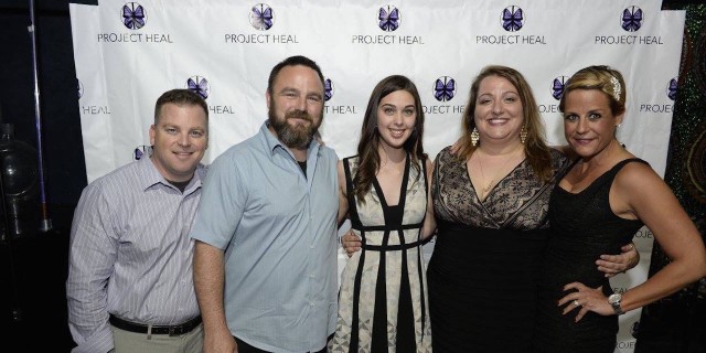 the author smiling with a group of people