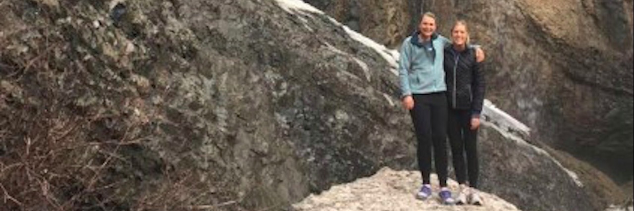 How I Take Care of My Mental Health While Chronically Ill Two friends standing near a waterfall.