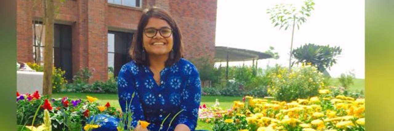 Will My Panic Attacks Get Easier to Handle? woman sitting in a daisy field