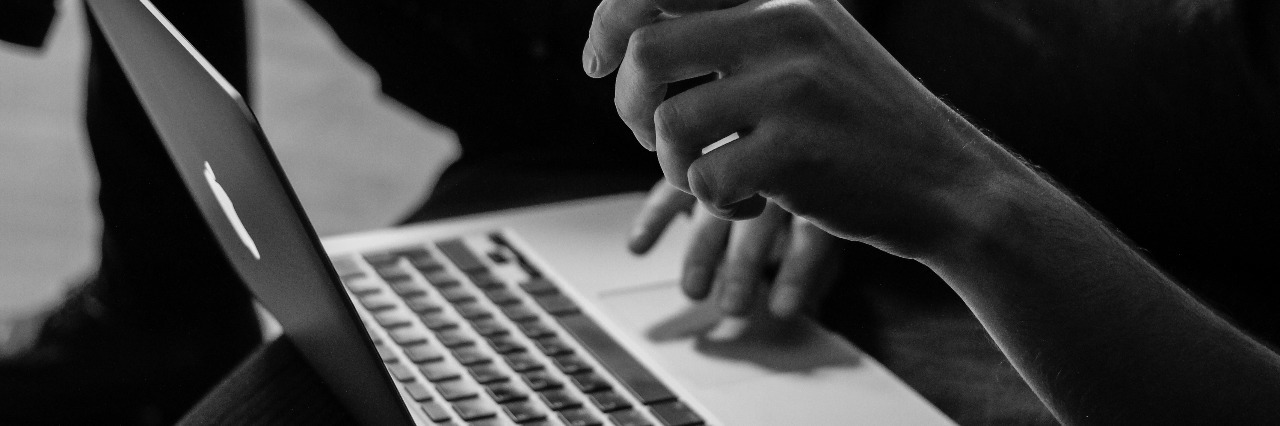 Why I Recorded Myself for Months During Depression woman working on laptop in black and white