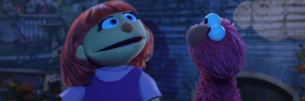 Seeing My Daughter in Sesame Street's Julia Sesame Street muppets Julia and Elmo singing outdoors at night