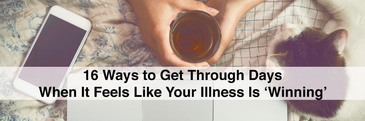 Top view image of woman hands on her bed using a laptop while drinking tea and petting a cat. with text 16 ways to get through days when it feels like your illness is winning