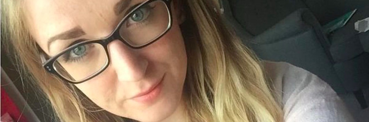 What Brain Fog From Hypothyroidism Is Like at Work girl selfie with glasses