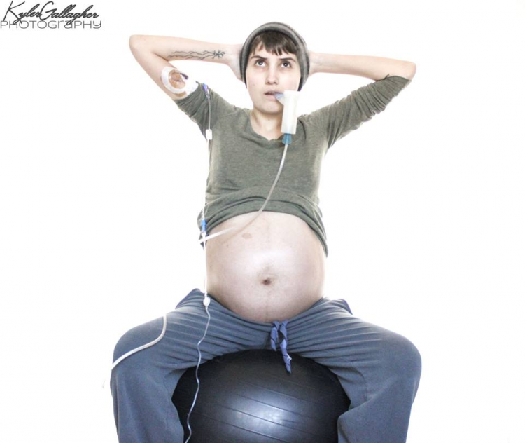 pregnant woman sitting on exercise ball with breathing machines