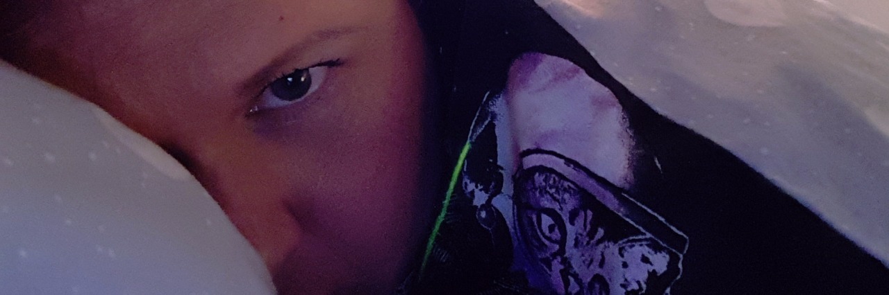 Hypermobile Ehlers-Danlos Syndrome and 'Paying' for Energy woman trying to sleep