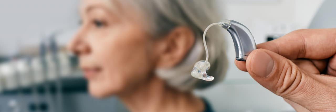 Close-up of small silver hearing aid