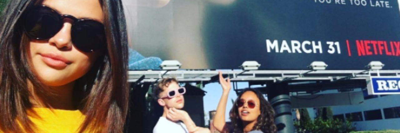 Selena Gomez and '13 Reasons Why' Cast Get Semicolon Tattoos Selena Gomez. Tommy Dorfman and Alisha Boe standing in front of a '13 Reasons Why' Billboard
