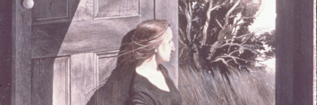 Child Loss Doesn't Mean My Child Is 'Lost' Portrait of a woman leaning against a large wooden door looking into the outdoors