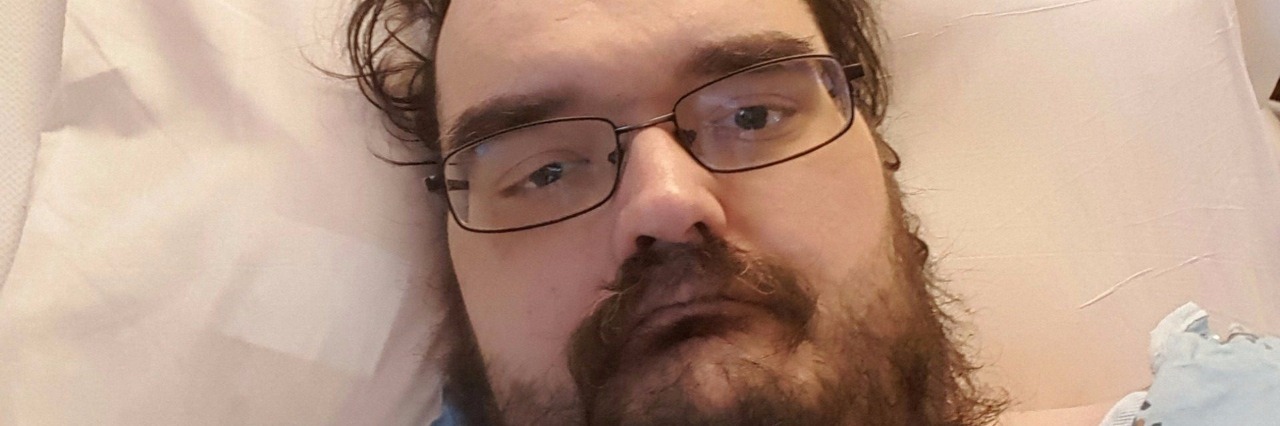 Around a Hospital in 80 Days for Ulcerative Colitis man in hospital bed