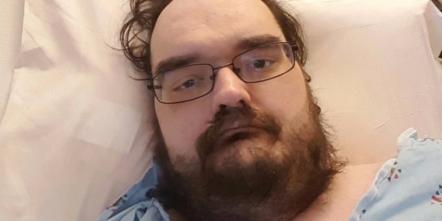 Around a Hospital in 80 Days for the Ulcerative Colitis That Almost Killed Me man in hospital bed