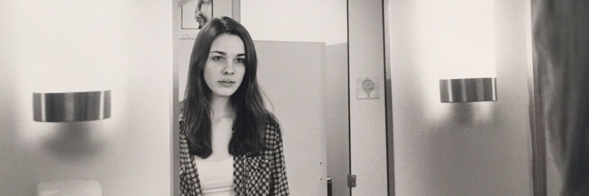 To My Body Fighting an Undiagnosed Neurological Condition photo of a woman looking at herself in a mirror