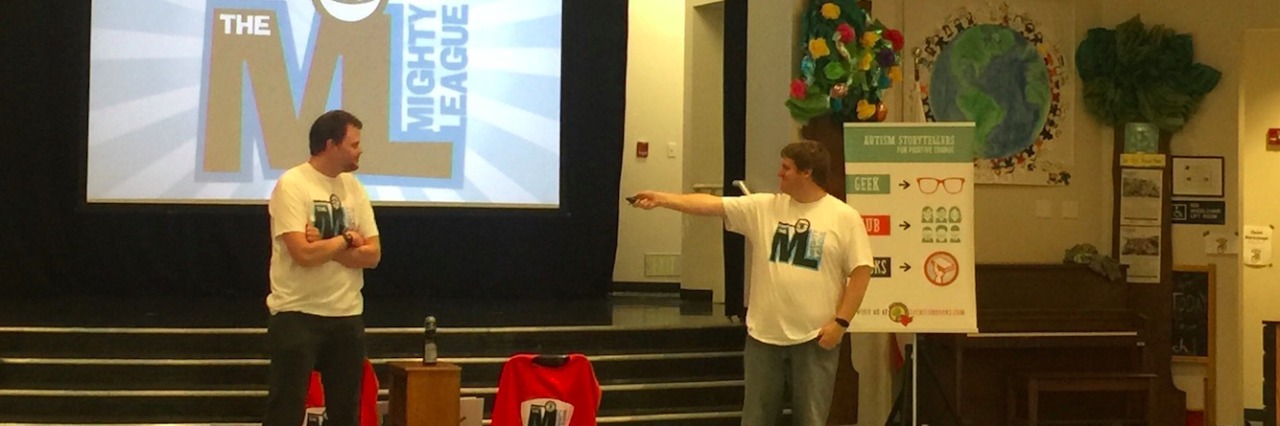 Ways Self-Advocates, Parents and Educators Spread Autism Awareness Jonathan and James at a Mighty League assembly, with children sitting and watching the presentation