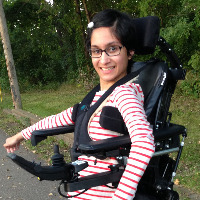 Neha in her standing wheelchair.
