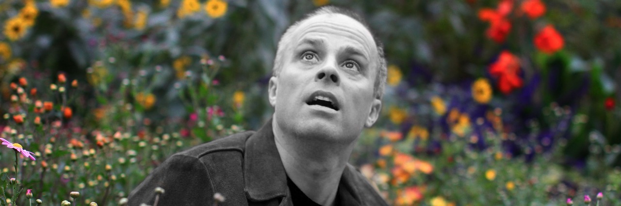 Peter Michael Marino: Thinking vs. Doing with Social Anxiety peter michael marino show up photo black and white man in colourful meadow surrounded by flowers