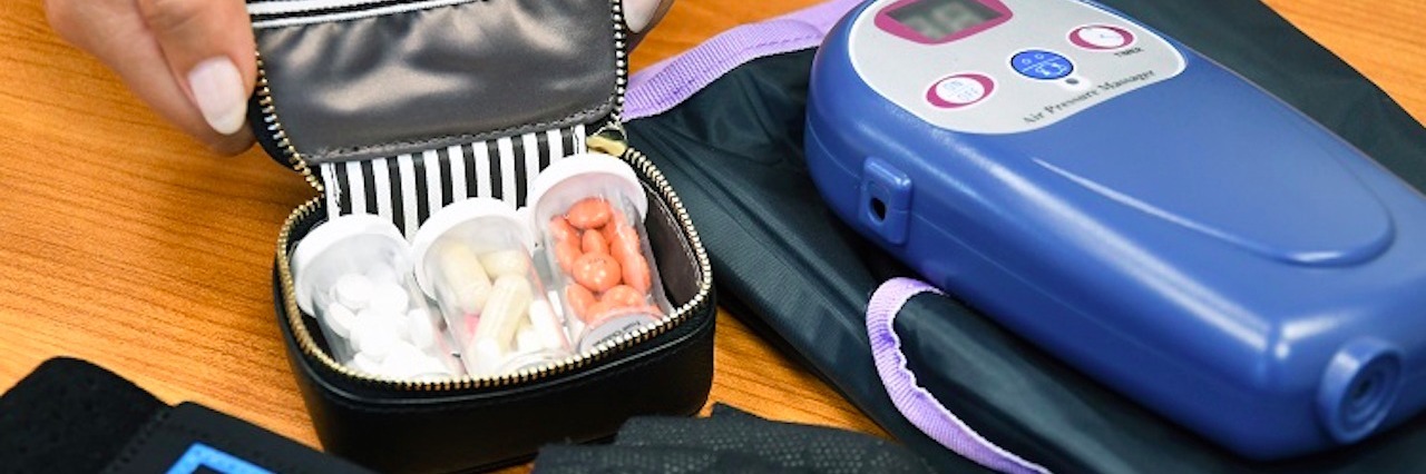 3 Technological Devices That Relieve Chronic Pain pills, black gloves and electric pain device