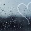 heart drawn on rainy window